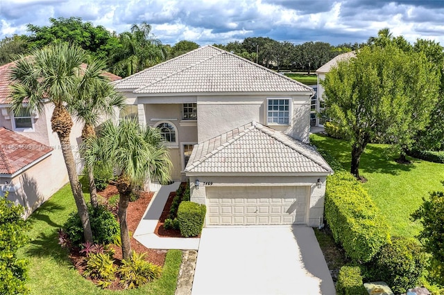 mediterranean / spanish-style house with a garage