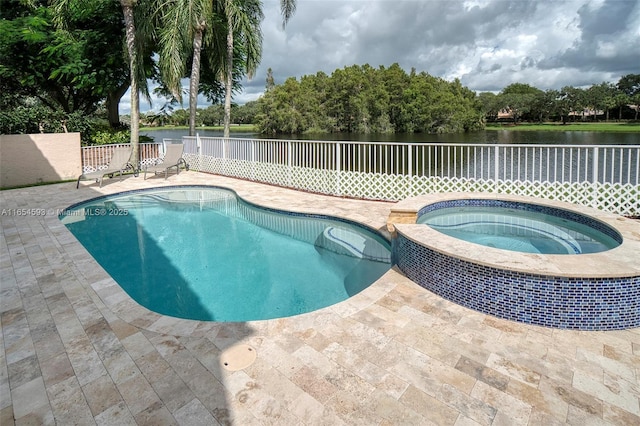 view of swimming pool featuring a patio area, a water view, and an in ground hot tub