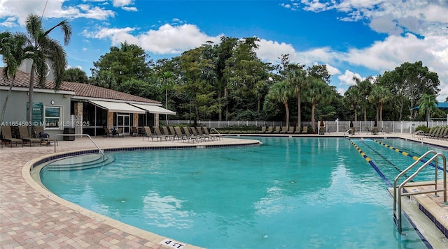 view of swimming pool featuring a patio area