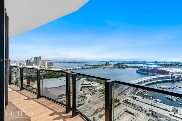 balcony featuring a water view