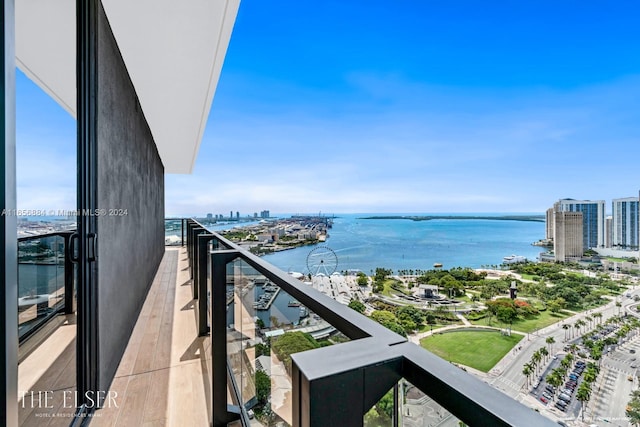 balcony featuring a water view