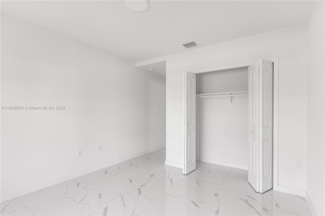 unfurnished bedroom featuring a closet