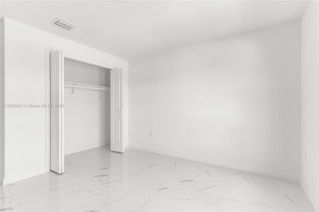 unfurnished bedroom featuring a closet