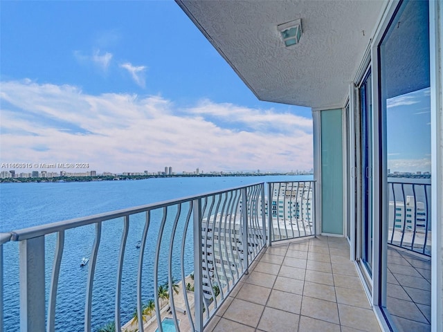 balcony featuring a water view