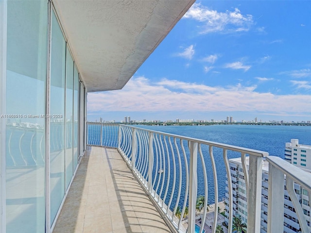 balcony featuring a water view