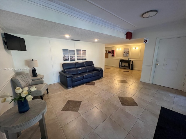 living room featuring a textured ceiling and light tile patterned floors