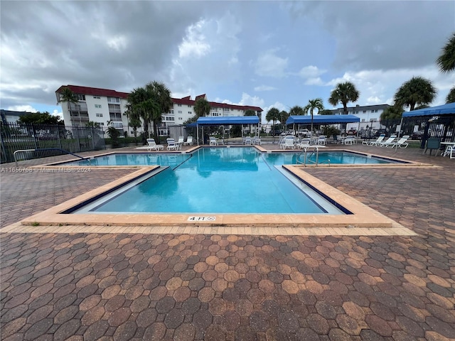 view of swimming pool featuring a patio