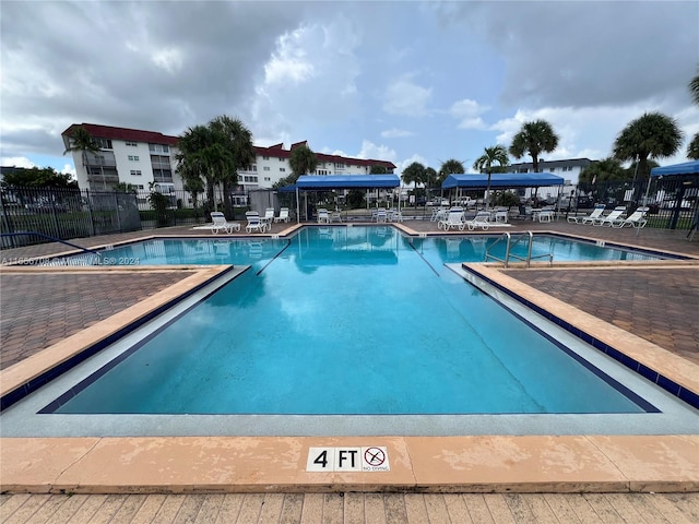 view of swimming pool featuring a patio area