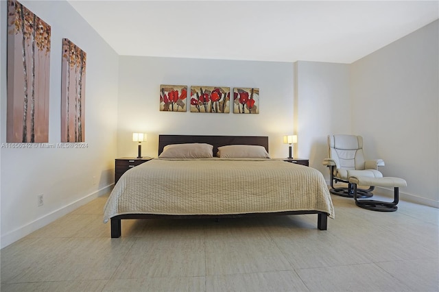 bedroom featuring light tile patterned floors