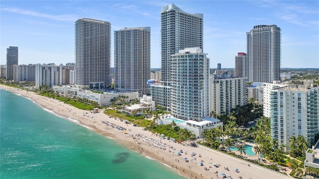 property's view of city featuring a beach view and a water view