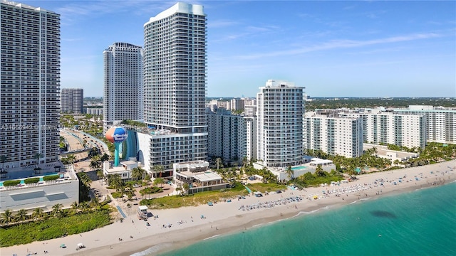 exterior space featuring a beach view and a water view