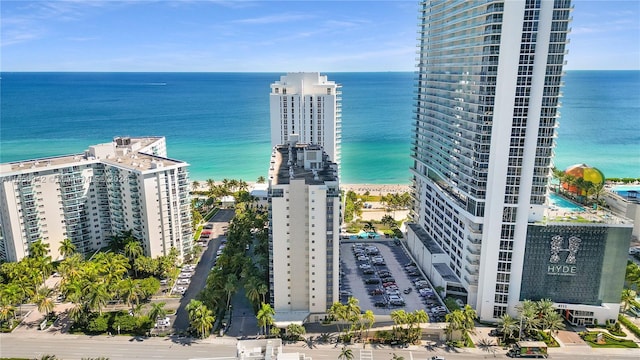 aerial view featuring a water view and a view of the beach