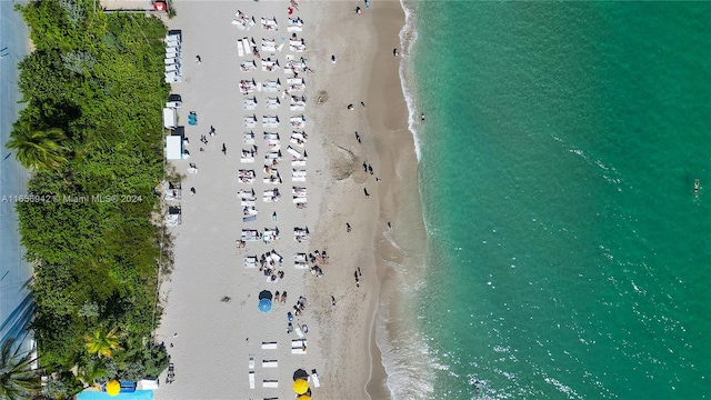 bird's eye view with a beach view and a water view