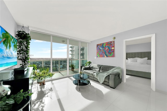 tiled living room featuring expansive windows