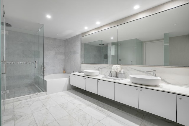 10203 Collins Ave Unit 801, Bal Harbour, FL 33154 - bathroom with double vanity, a stall shower, a bath, recessed lighting, and marble finish flooring