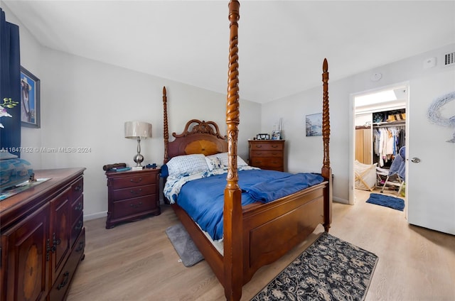 bedroom featuring light hardwood / wood-style floors and a closet