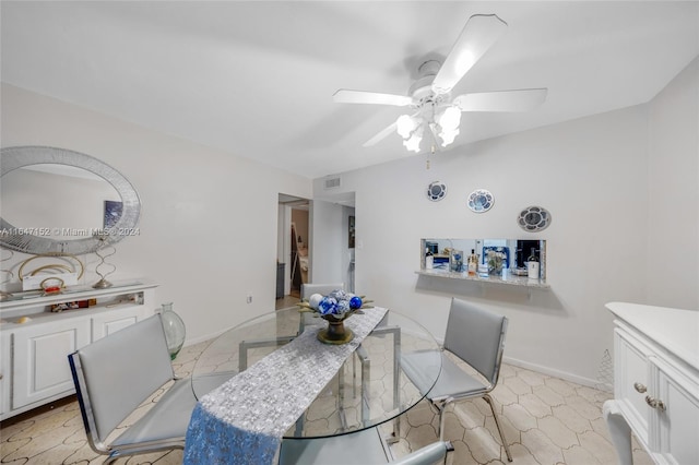 dining space with ceiling fan