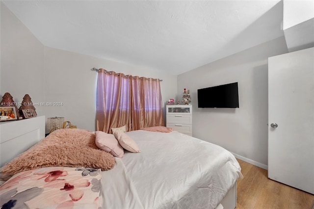 bedroom with light wood-type flooring