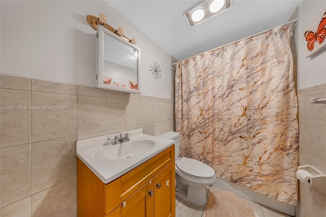 bathroom featuring tile walls, curtained shower, vanity, tile patterned flooring, and toilet