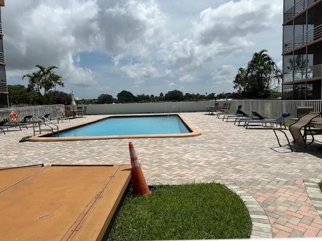 view of swimming pool with a patio area