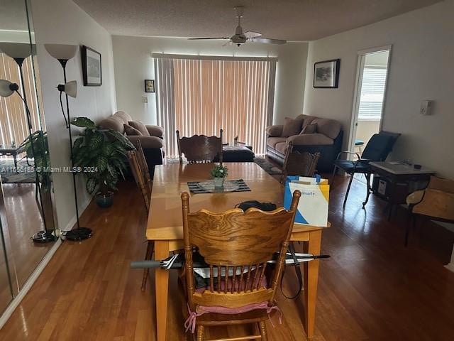 dining room featuring ceiling fan and dark hardwood / wood-style floors