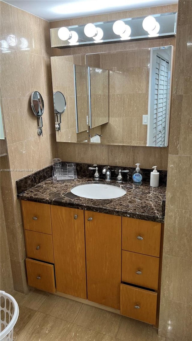 bathroom with tile patterned floors and vanity