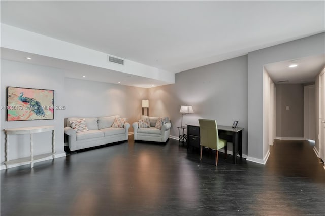 living room featuring dark hardwood / wood-style flooring