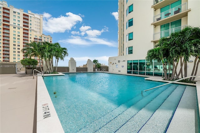 view of pool featuring a patio