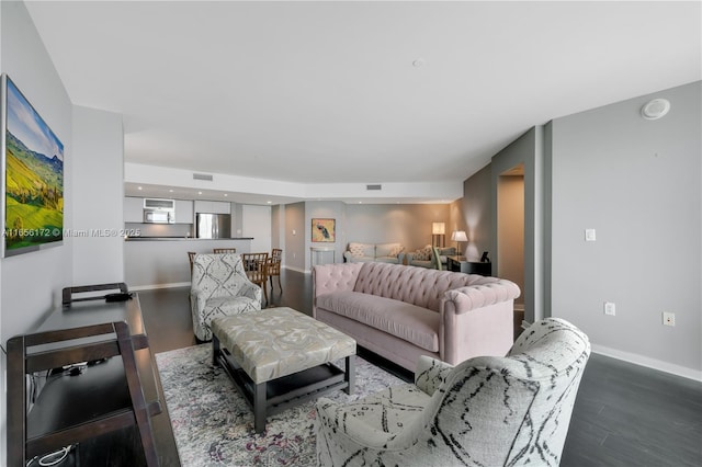 living room featuring dark wood-type flooring