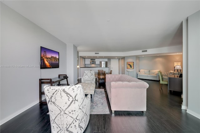 living room with dark hardwood / wood-style floors