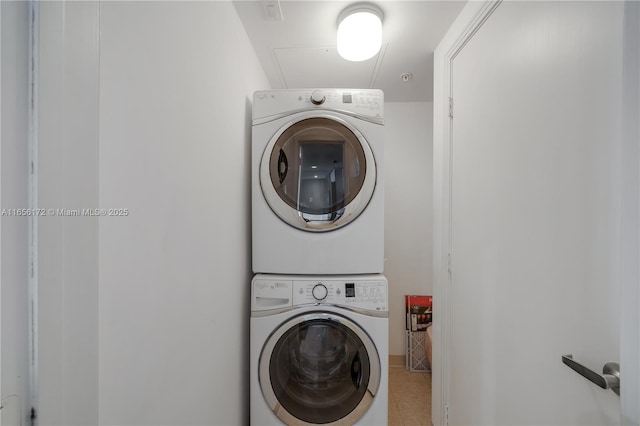 laundry room featuring stacked washer / dryer