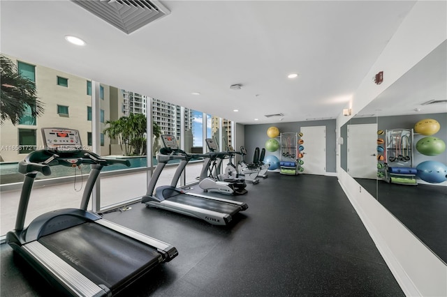 workout area with floor to ceiling windows