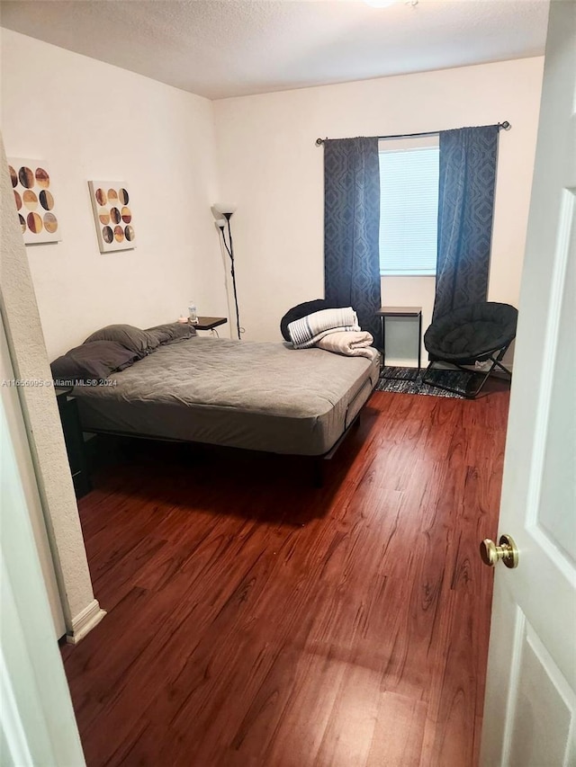 bedroom featuring dark hardwood / wood-style floors