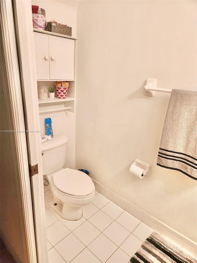 bathroom featuring tile patterned flooring and toilet