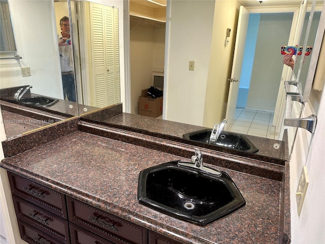 kitchen featuring tile patterned floors and sink