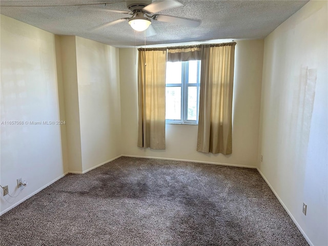 spare room with carpet flooring, a textured ceiling, and ceiling fan