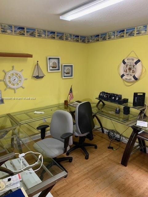 home office featuring hardwood / wood-style flooring