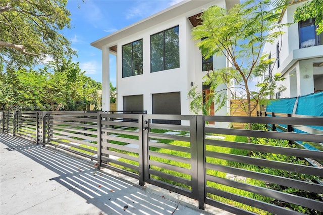 exterior space with a garage and stucco siding