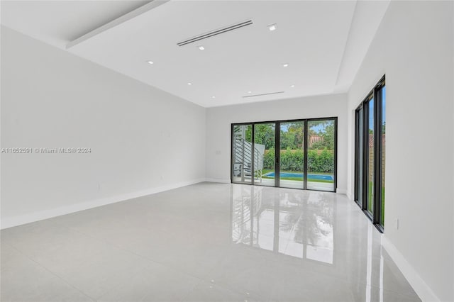 empty room with recessed lighting and baseboards