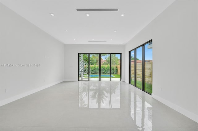 empty room featuring visible vents and baseboards