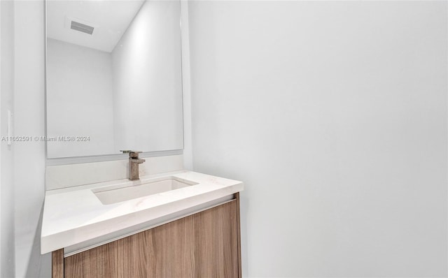 bathroom with visible vents and vanity