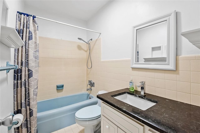 full bathroom featuring shower / bath combo, tile patterned flooring, toilet, vanity, and tile walls