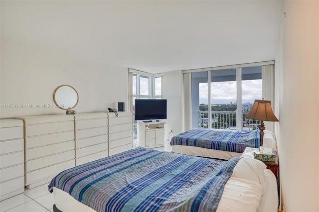 tiled bedroom featuring access to exterior