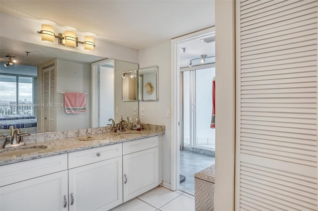 bathroom with vanity and tile patterned flooring