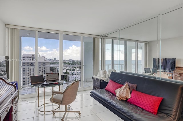 tiled living room with a wall of windows