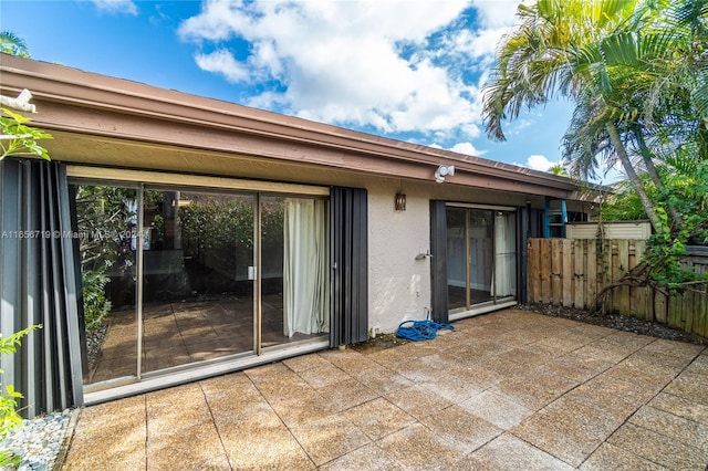 back of property with a patio