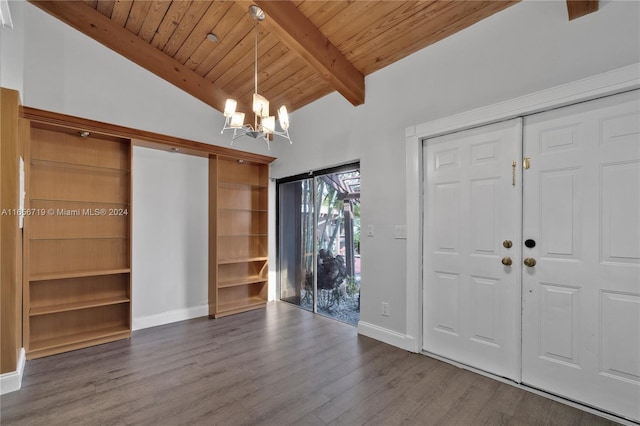 unfurnished bedroom featuring wood ceiling, hardwood / wood-style flooring, an inviting chandelier, and vaulted ceiling with beams