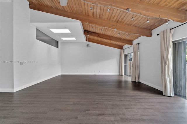 empty room with wood ceiling, dark hardwood / wood-style flooring, and lofted ceiling with skylight