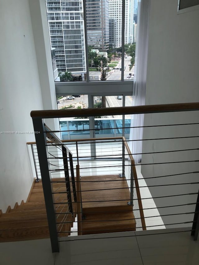 staircase featuring hardwood / wood-style flooring