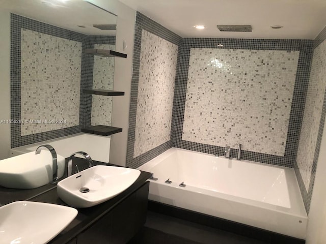 bathroom with vanity and independent shower and bath